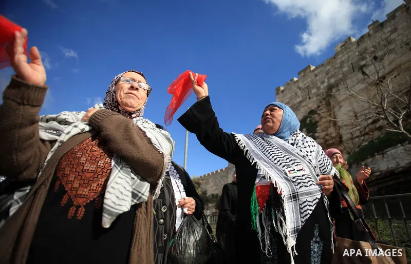Palestinians participate in a simulated wedding marking the International Women's Day, in Jerusalem's Old City March 10, 2014. Photo by Saeed Qaq
