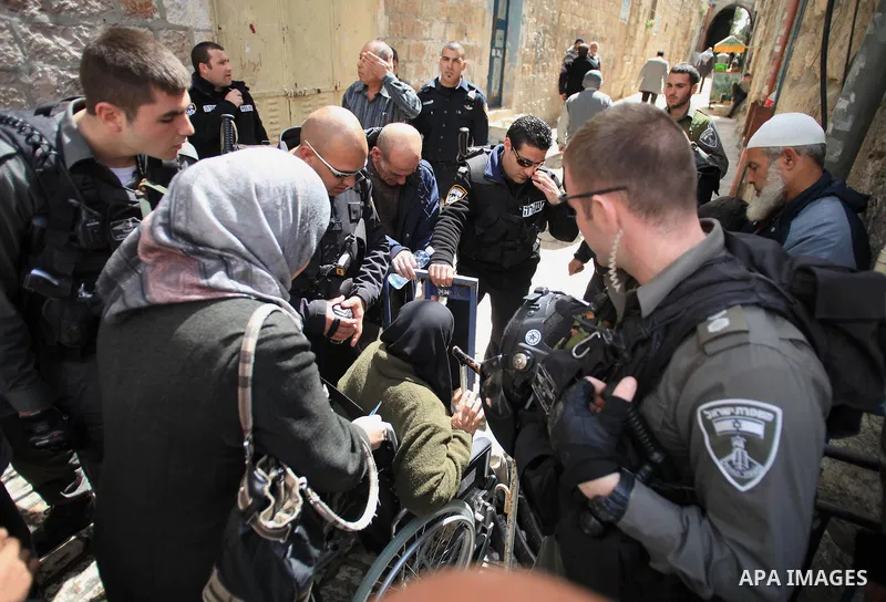 Israeli policemen stand guard as they try to prevent Palestinians from entering the al-Aqsa mosque compound, in Jerusalem's Old City on March 11, 2014. Israeli authorities on Tuesday closed a number of Al-Aqsa Mosque com...