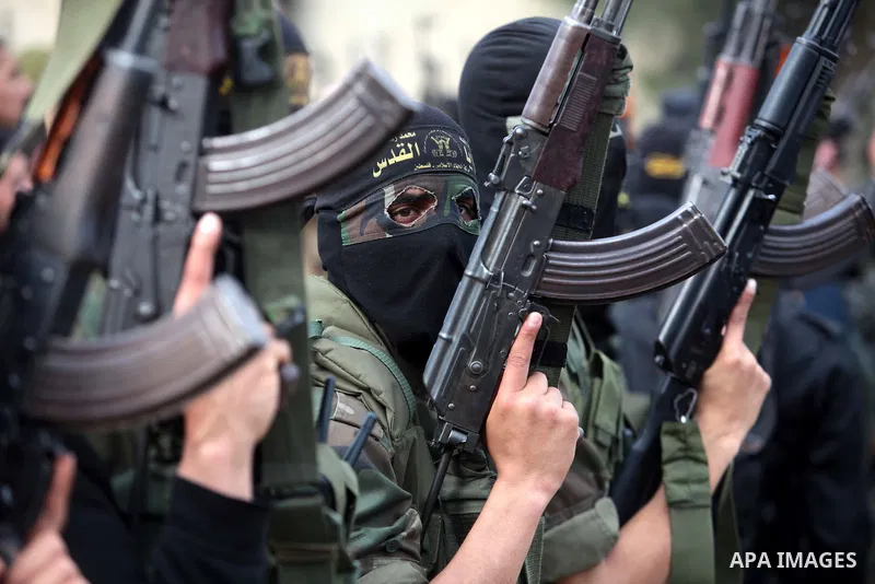 Islamic jihad militants take part in the funeral of three comrades, who were killed in an Israeli air strike, in Khan Younis in the southern Gaza Strip March 11, 2014. An Israeli air strike on Tuesday killed three Palest...
