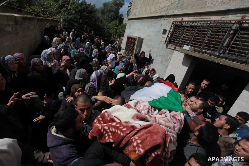 Palestinians carry the body of Kareem Hamad during his funeral at Beit Hanoun on the northern Gaza Strip March 12, 2014. A blast in a second-storey apartment killed Hamad and other two militants belonging to a small Jiha...
