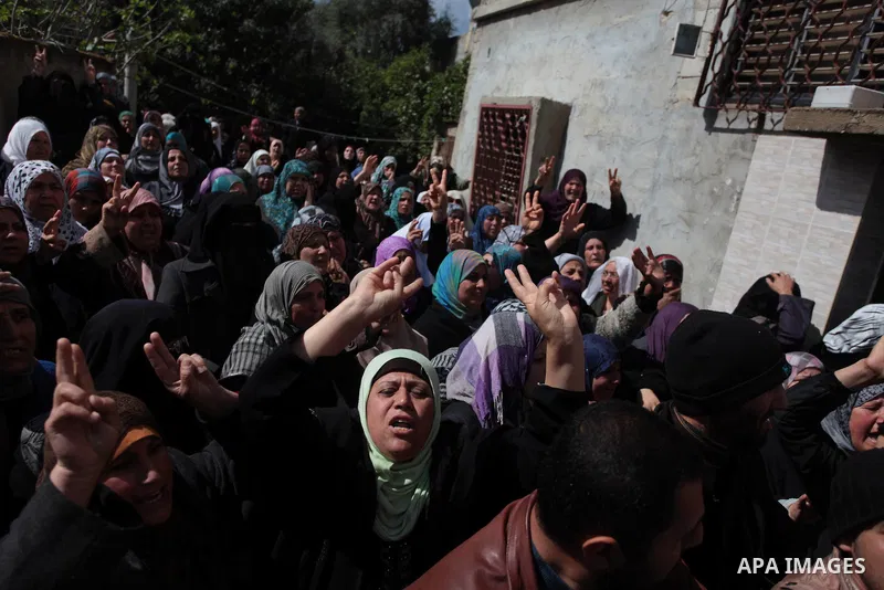 Relatives of Palestinian Kareem Hamad mourn during his funeral at Beit Hanoun on the northern Gaza Strip March 12, 2014. A blast in a second-storey apartment killed Hamad and other two militants belonging to a small Jiha...