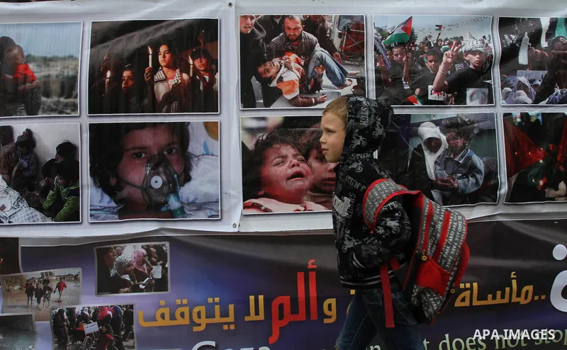A Palestinian student takes part a protest against the Egyptian-Israeli Blockade on Gaza strip, in front of the Egyptian Embassy in Gaza City, on March 12, 2014. Photo by Mohammed Asad