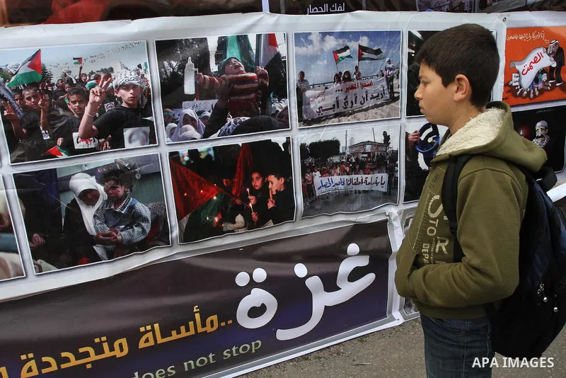 A Palestinian student takes part a protest against the Egyptian-Israeli Blockade on Gaza strip, in front of the Egyptian Embassy in Gaza City, on March 12, 2014. Photo by Mohammed Asad