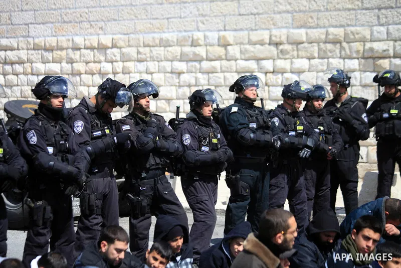 Palestinian Muslims pray outside of the Old City of Jerusalem as Israeli police block them from praying in the city's Al-Aqsa mosque, in the Ras Al-Amud neighborhood of East Jerusalem on 14 March 2014. Israel restricted...