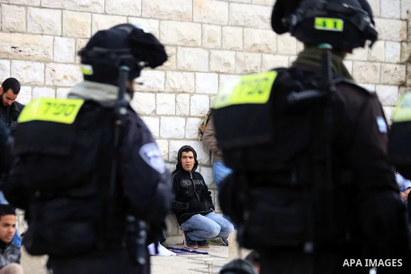 Palestinian Muslims pray outside of the Old City of Jerusalem as Israeli police block them from praying in the city's Al-Aqsa mosque, in the Ras Al-Amud neighborhood of East Jerusalem on 14 March 2014. Israel restricted...