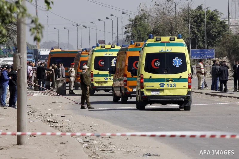 Egyptian soldiers and officials inspect the sight where gunmen killed six soldiers at a Cairo checkpoint on March 15, 2014 in an attack the military blamed on the Muslim Brotherhood movement of deposed president Mohamed...