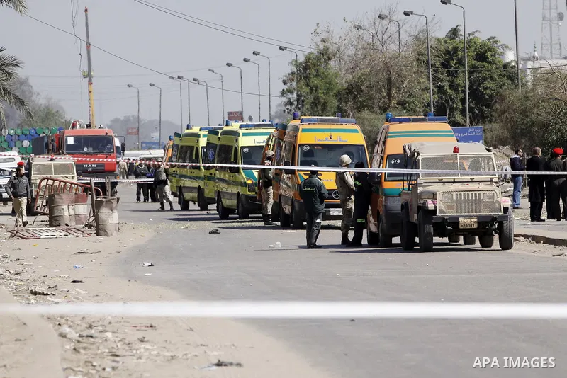 Egyptian soldiers and officials inspect the sight where gunmen killed six soldiers at a Cairo checkpoint on March 15, 2014 in an attack the military blamed on the Muslim Brotherhood movement of deposed president Mohamed...