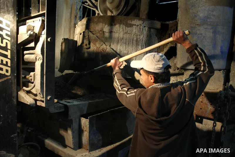 Palestinian construction workers work at night in Gaza city, on March 15, 2014. The Gaza Strip's sole power station stopped generating electricity on Saturday, causing blackouts throughout the territory after it ran out...