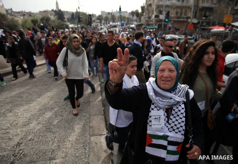 Palestinian protesters chant slogans during a demonstration in Jerusalem's Old City, 16 March 2014, when Palestinians were prevented from entering al-Aqsa Mosque for prayers. Earlier in the day protests took place inside...