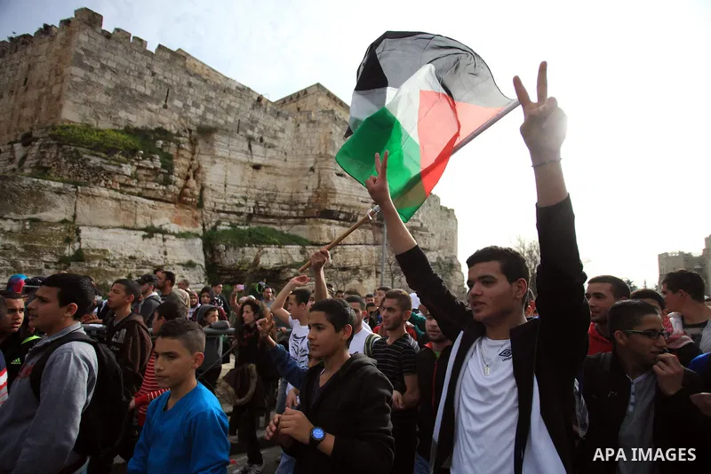 Palestinian protesters chant slogans during a demonstration in Jerusalem's Old City, 16 March 2014, when Palestinians were prevented from entering al-Aqsa Mosque for prayers. Earlier in the day protests took place inside...