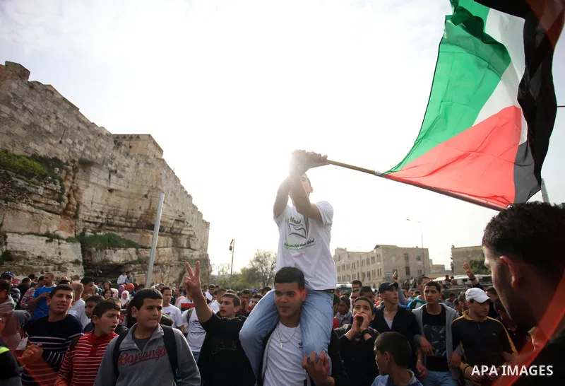 Palestinian protesters chant slogans during a demonstration in Jerusalem's Old City, 16 March 2014, when Palestinians were prevented from entering al-Aqsa Mosque for prayers. Earlier in the day protests took place inside...