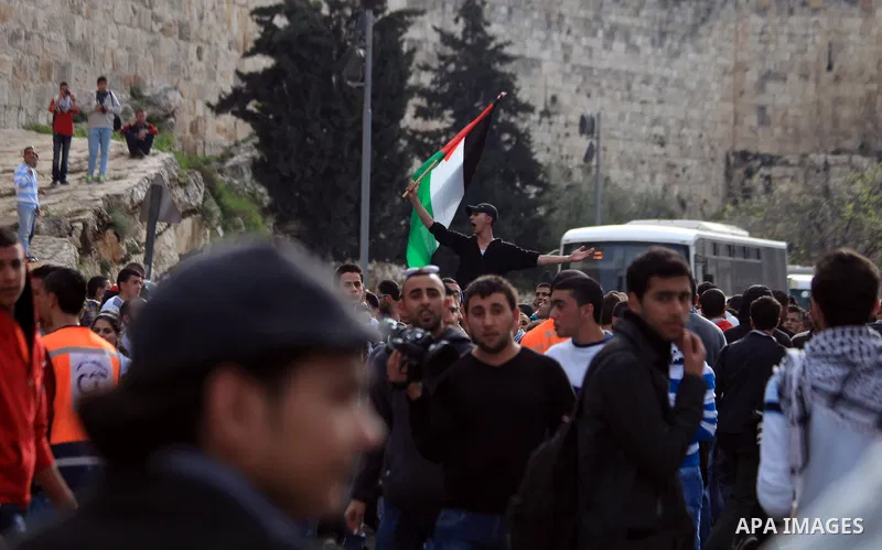 Palestinian protesters chant slogans during a demonstration in Jerusalem's Old City, 16 March 2014, when Palestinians were prevented from entering al-Aqsa Mosque for prayers. Earlier in the day protests took place inside...