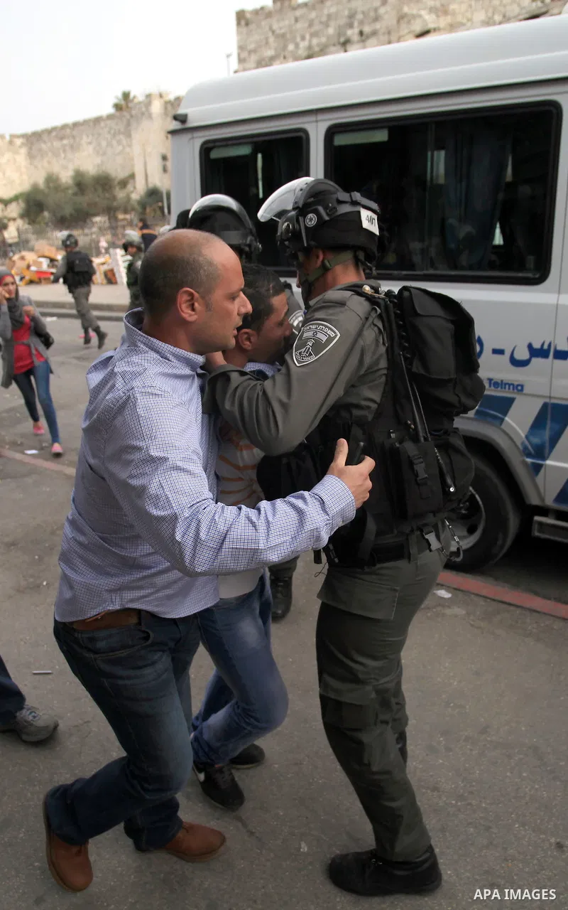 Israeli riot police lead away a Palestinian young as he is arrested during stone-throwing clashes near the Damascus Gate in East Jerusalem, 16 March 2014. Earlier in the day protests took place inside the Old City when P...