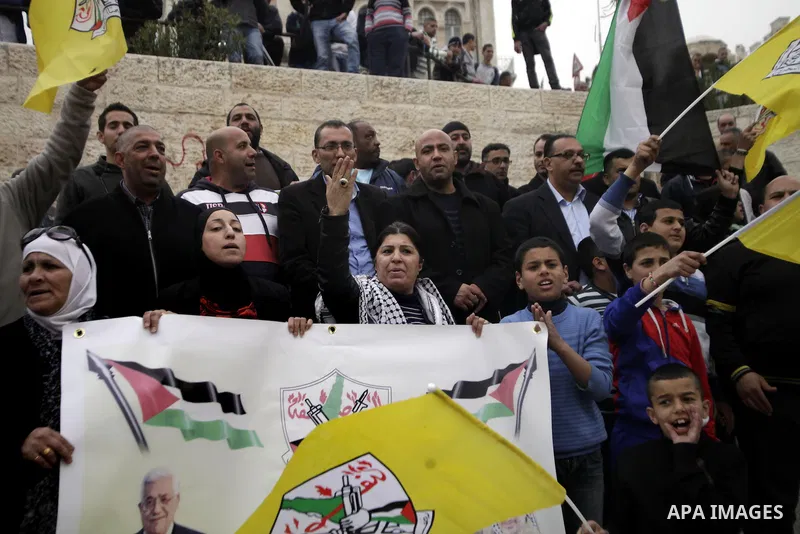Palestinians take part in a rally in Jerusalem's Old City on March 17, 2014, to show their support for Palestinian president Mahmud Abbas who is on an official visit to the US capital, Washington DC. President Barack Oba...