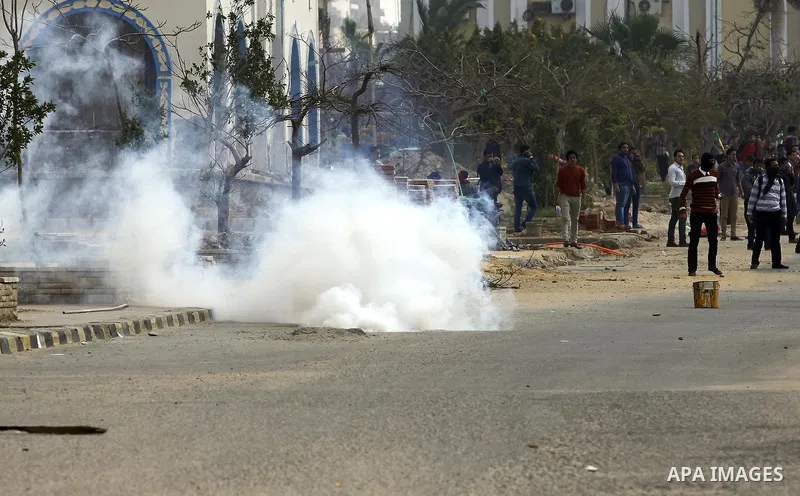 Egyptian students of al-Azhar University who are supporters of the Muslim Brotherhood and ousted Egyptian President Mohamed Mursi, throw stones at riot police during clashes in Cairo's Nasr City district, March 19, 2014....