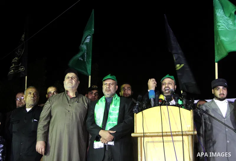 Palestinian supporters of Hamas and Jihad Islamic movements chant slogans during a protest in Gaza City on March 22, 2014 against the killing of three Palestinians were killed in Jenin refugee camp in the West Bank durin...