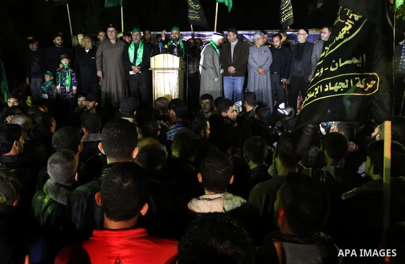 Palestinian supporters of Hamas and Jihad Islamic movements chant slogans during a protest in Gaza City on March 22, 2014 against the killing of three Palestinians were killed in Jenin refugee camp in the West Bank durin...