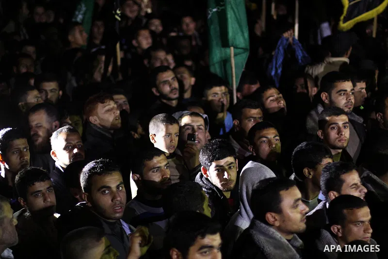 Palestinian supporters of Hamas and Jihad Islamic movements chant slogans during a protest in Gaza City on March 22, 2014 against the killing of three Palestinians were killed in Jenin refugee camp in the West Bank durin...