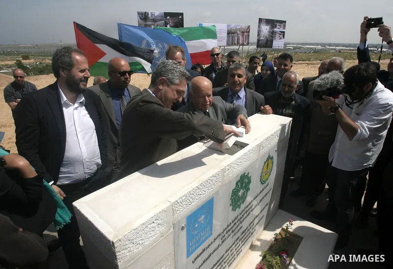 Commissioner General of the United Nations Relief and Works Agency (UNRWA) Filippo Grandi, places the foundation stone for the Kuwait School in khan younis in southern in Gaza strip on March 23, 2014. Funded by Kuwait fu...
