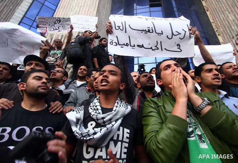 Egyptian journalists chant slogans during a protest the death of the Egyptian journalist Mayada Ashraf, outside the Egyptian Journalist Syndicate in Cairo, on March 29, 2014. Al-Dustour, a privately-owned newspaper, said...