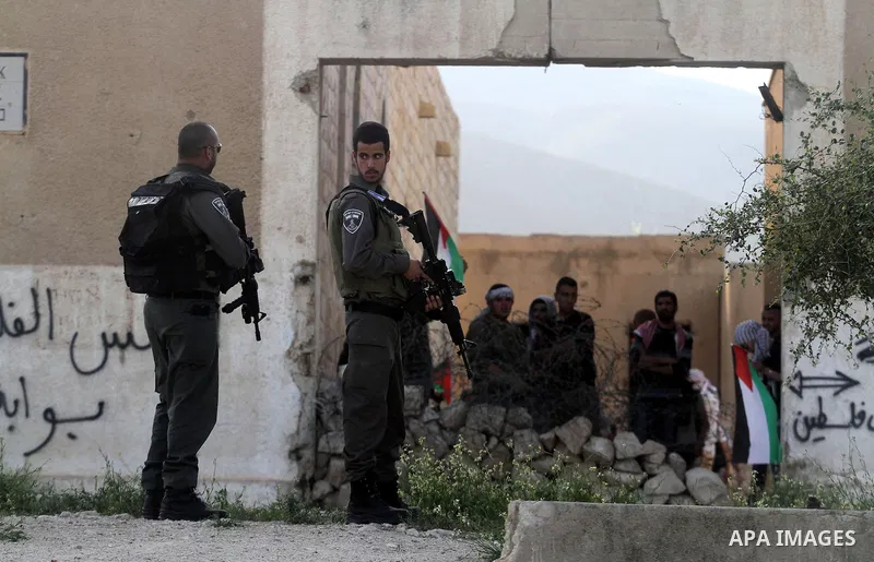 Palestinian and foreign activists during protest in Bawaba Karama Village, near of the West Bank City of Jericho March 29, 2014. Hundreds of Palestinians announced campaign Building the village of Bawaba Karama marking t...