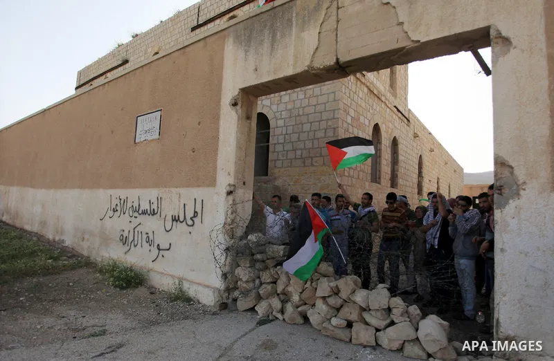 Palestinian and foreign activists during protest in Bawaba Karama Village, near of the West Bank City of Jericho March 29, 2014. Hundreds of Palestinians announced campaign Building the village of Bawaba Karama marking t...