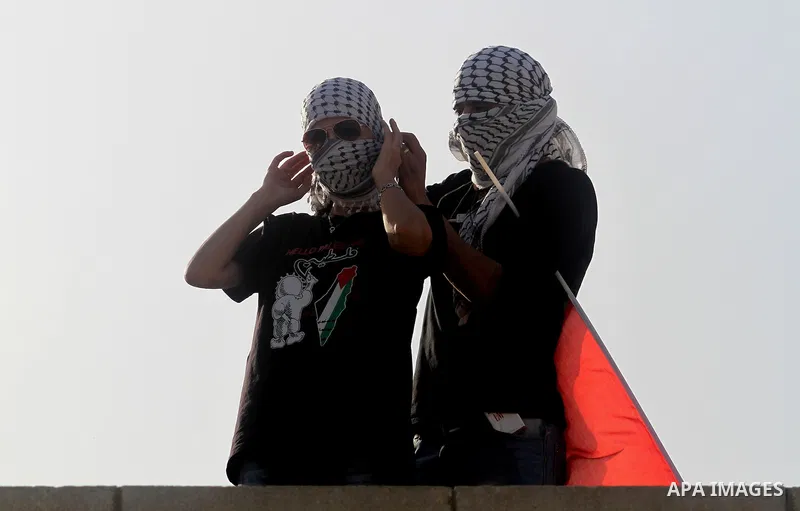 Palestinian and foreign activists during protest in Bawaba Karama Village, near of the West Bank City of Jericho March 29, 2014. Hundreds of Palestinians announced campaign Building the village of Bawaba Karama marking t...