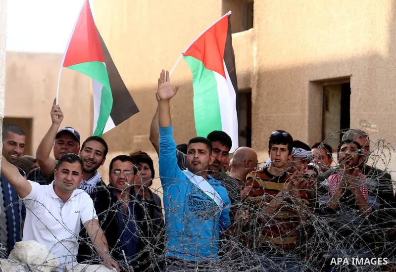 Palestinian and foreign activists during protest in Bawaba Karama Village, near of the West Bank City of Jericho March 29, 2014. Hundreds of Palestinians announced campaign Building the village of Bawaba Karama marking t...