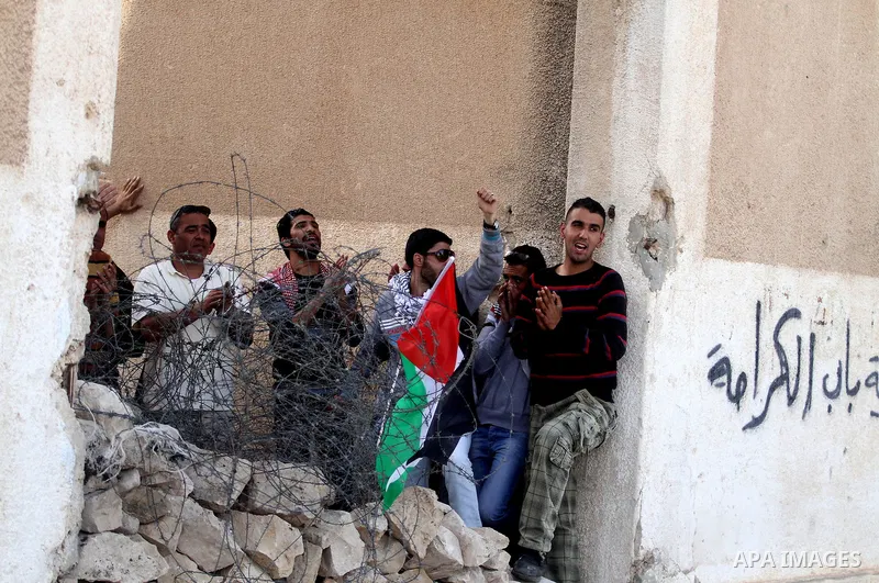Palestinian and foreign activists during protest in Bawaba Karama Village, near of the West Bank City of Jericho March 29, 2014. Hundreds of Palestinians announced campaign Building the village of Bawaba Karama marking t...