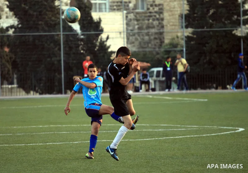Palestinian Local players play with wahdat sport club from Jordan during their match, at Jerusalem city, on March 29, 2014. Palestinian Sakhnin players win in the International Cup of Jerusalem. Photo by Saeed Qaq