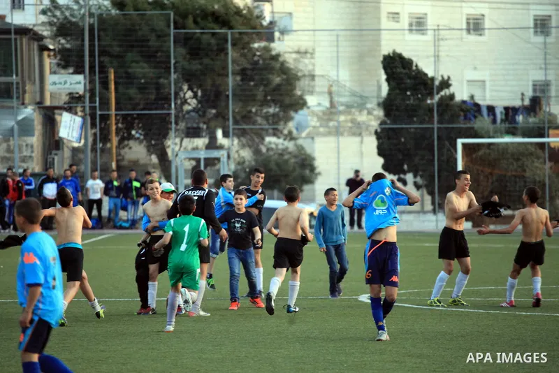 Palestinian Local players play with wahdat sport club from Jordan during their match, at Jerusalem city, on March 29, 2014. Palestinian Sakhnin players win in the International Cup of Jerusalem. Photo by Saeed Qaq