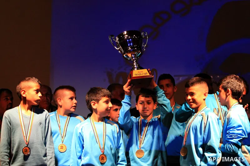 Palestinian Local players play with wahdat sport club from Jordan during their match, at Jerusalem city, on March 29, 2014. Palestinian Sakhnin players win in the International Cup of Jerusalem. Photo by Saeed Qaq