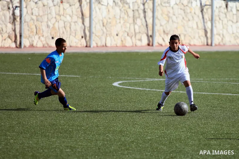 Palestinian Local players play with wahdat sport club from Jordan during their match, at Jerusalem city, on March 29, 2014. Palestinian Sakhnin players win in the International Cup of Jerusalem. Photo by Saeed Qaq