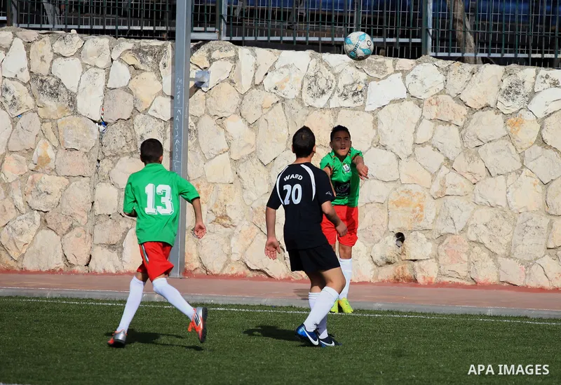 Palestinian Local players play with wahdat sport club from Jordan during their match, at Jerusalem city, on March 29, 2014. Palestinian Sakhnin players win in the International Cup of Jerusalem. Photo by Saeed Qaq