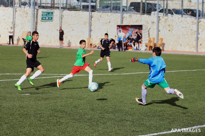 Palestinian Local players play with wahdat sport club from Jordan during their match, at Jerusalem city, on March 29, 2014. Palestinian Sakhnin players win in the International Cup of Jerusalem. Photo by Saeed Qaq