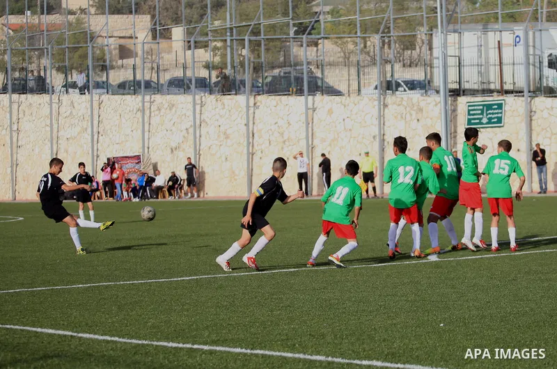 Palestinian Local players play with wahdat sport club from Jordan during their match, at Jerusalem city, on March 29, 2014. Palestinian Sakhnin players win in the International Cup of Jerusalem. Photo by Saeed Qaq