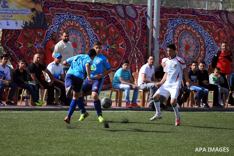 Palestinian Local players play with wahdat sport club from Jordan during their match, at Jerusalem city, on March 29, 2014. Palestinian Sakhnin players win in the International Cup of Jerusalem. Photo by Saeed Qaq
