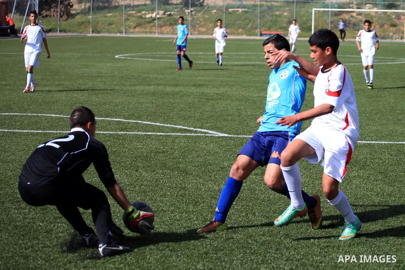 Palestinian Local players play with wahdat sport club from Jordan during their match, at Jerusalem city, on March 29, 2014. Palestinian Sakhnin players win in the International Cup of Jerusalem. Photo by Saeed Qaq