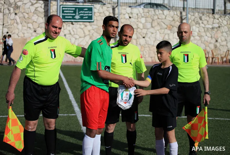 Palestinian Local players play with wahdat sport club from Jordan during their match, at Jerusalem city, on March 29, 2014. Palestinian Sakhnin players win in the International Cup of Jerusalem. Photo by Saeed Qaq