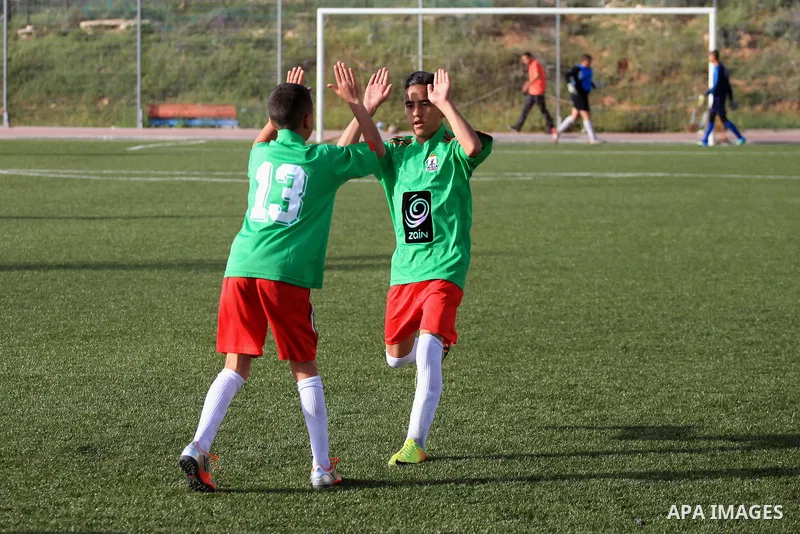 Palestinian Local players play with wahdat sport club from Jordan during their match, at Jerusalem city, on March 29, 2014. Palestinian Sakhnin players win in the International Cup of Jerusalem. Photo by Saeed Qaq