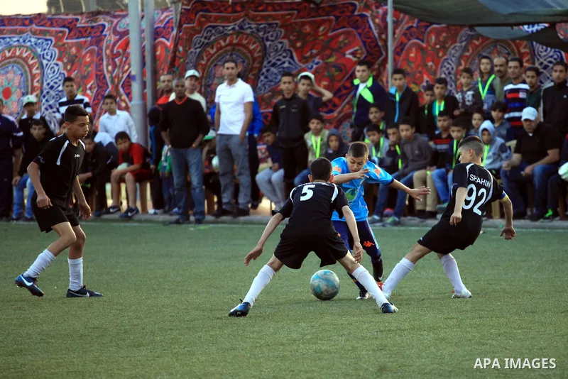 Palestinian Local players play with wahdat sport club from Jordan during their match, at Jerusalem city, on March 29, 2014. Palestinian Sakhnin players win in the International Cup of Jerusalem. Photo by Saeed Qaq
