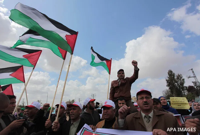 Palestinians shout slogans during a march to mark Land Day in the northern Gaza Strip March 30, 2014. The annual demonstrations mark the deaths of six Arab Israeli protesters at the hands of Israeli police and troops dur...