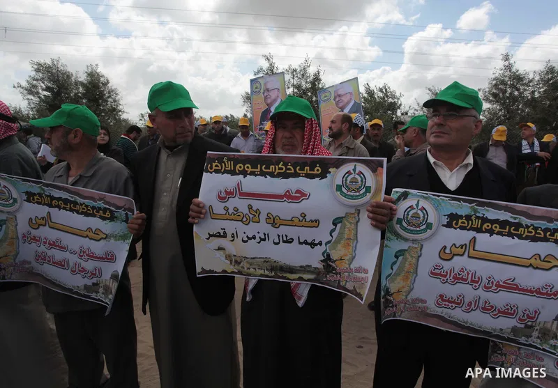 Palestinians shout slogans during a march to mark Land Day in the northern Gaza Strip March 30, 2014. The annual demonstrations mark the deaths of six Arab Israeli protesters at the hands of Israeli police and troops dur...