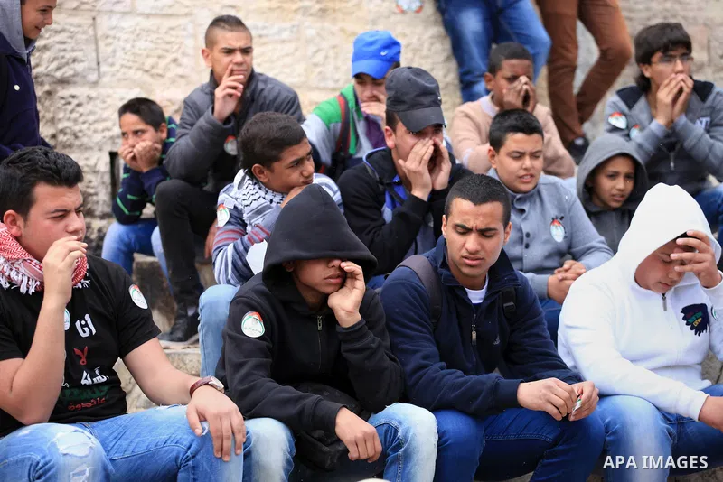Palestinian protesters chant slogans during a march marking the Land Day in Jerusalem, March 29, 2014. The Land Day commemorates the Israeli government expropriation of thousands of dunams of land from Palestinians in 19...