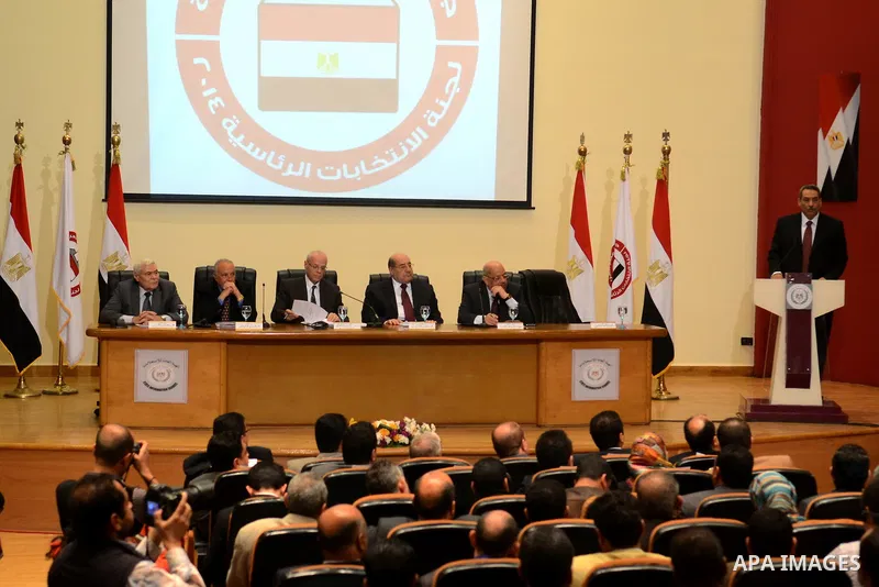 Egyptian members of Presidential election commission hold a press conference in Cairo, March 30, 2014. Egypt's election commission said that the first round of voting for the country's new president will be held on May 2...