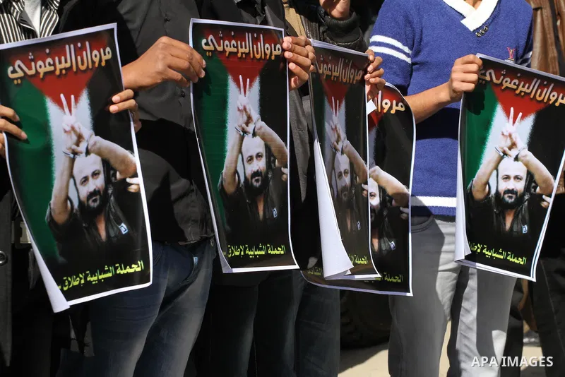 Palestinians take part in a protest demanding the release of their relatives prisoners held in Israeli jails, in front of the Red Cross office in Gaza City, on March 31, 2014. Photo by Mohammed Asad