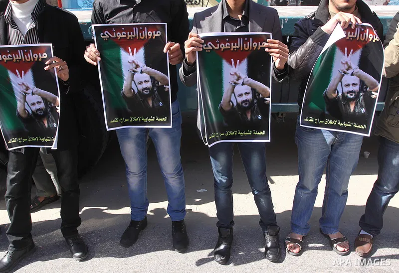 Palestinians take part in a protest demanding the release of their relatives prisoners held in Israeli jails, in front of the Red Cross office in Gaza City, on March 31, 2014. Photo by Mohammed Asad