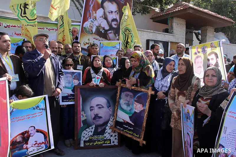 Palestinians take part in a protest demanding the release of their relatives prisoners held in Israeli jails, in front of the Red Cross office in Gaza City, on March 31, 2014. Photo by Mohammed Asad
