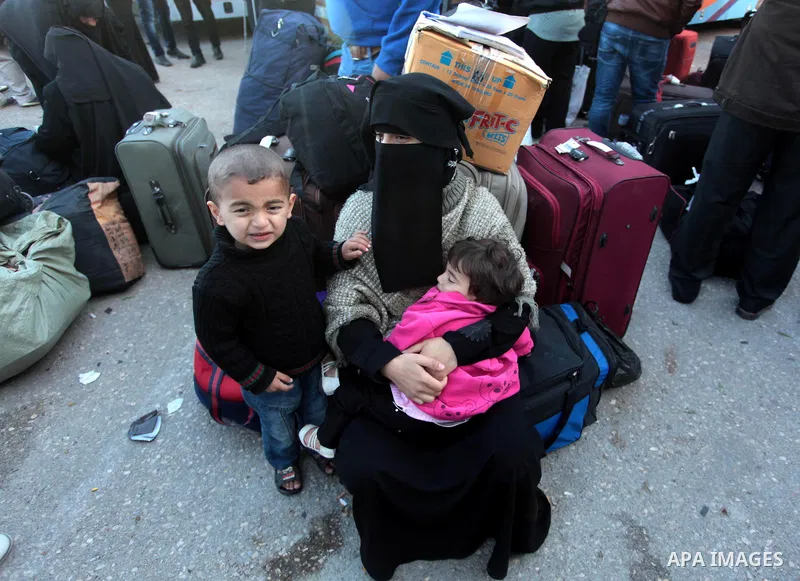 Palestinians hoping to cross into Egypt wait at the Rafah crossing between Egypt and the southern Gaza Strip March 31, 2014. Egyptian authorities partially reopened Rafah border crossing, Gaza's main window to the world,...