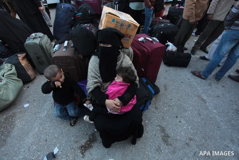 Palestinians hoping to cross into Egypt wait at the Rafah crossing between Egypt and the southern Gaza Strip March 31, 2014. Egyptian authorities partially reopened Rafah border crossing, Gaza's main window to the world,...